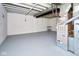 Unfinished basement with painted floors and exposed ceiling, offering versatile space for storage or future customization at 2606 Shakespeare Dr, Southport, IN 46227