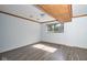 Finished room with hardwood-style flooring, offering versatile space for a den, office, or playroom at 2606 Shakespeare Dr, Southport, IN 46227