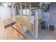 Basement view of framing, utilities, and exposed ductwork; ideal for finishing at 2650 S Meridian St, Indianapolis, IN 46225