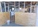 The basement features plywood walls and the start of framing with exposed ductwork and utilities at 2650 S Meridian St, Indianapolis, IN 46225