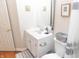 Bathroom with a white vanity, sink, and decorative elements on the walls at 2650 S Meridian St, Indianapolis, IN 46225