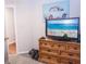 Bedroom featuring a dresser with a TV and an doorway, decorated with modern art at 2650 S Meridian St, Indianapolis, IN 46225
