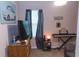 Bedroom with a piano, art, and moody, stylish decor at 2650 S Meridian St, Indianapolis, IN 46225