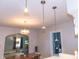 Open dining area enhanced by modern pendant lighting and seamlessly connected to the adjacent living spaces at 2650 S Meridian St, Indianapolis, IN 46225