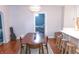 Cozy dining room featuring a wood table, seating, and access to another room at 2650 S Meridian St, Indianapolis, IN 46225