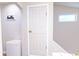 Basement door with a small freezer; perfect for extra storage or a wine cellar at 2650 S Meridian St, Indianapolis, IN 46225