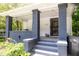 Close-up of inviting front porch with stylish columns and wrought iron door at 2650 S Meridian St, Indianapolis, IN 46225