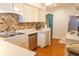 Functional kitchen features stainless steel appliances and ample counter space at 2650 S Meridian St, Indianapolis, IN 46225