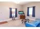 Bright living room featuring neutral colors, a TV, windows, and soft natural light at 2650 S Meridian St, Indianapolis, IN 46225