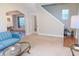 Spacious living room featuring neutral carpet, a stylish sofa, and a view of the dining area at 2650 S Meridian St, Indianapolis, IN 46225
