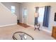 Cozy living room featuring neutral carpet, a stylish coffee table, and a view of the front door at 2650 S Meridian St, Indianapolis, IN 46225