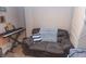 A cozy sitting area with a loveseat and keyboard in a basement rec room at 2650 S Meridian St, Indianapolis, IN 46225