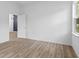 Bedroom with light wood look floors and a window overlooking the yard at 2709 Station St, Indianapolis, IN 46218