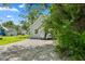 Charming single Gathering home with a rock driveway and a well-maintained front yard with mature trees at 2709 Station St, Indianapolis, IN 46218