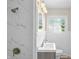 Contemporary bathroom features white marble tiles, modern lighting, and brushed bronze fixtures at 2829 Dakota Dr, Anderson, IN 46012