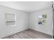 Cozy bedroom with luxury vinyl plank floors, modern windows, and neutral walls at 2829 Dakota Dr, Anderson, IN 46012