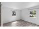 Empty room features two windows, light gray floors, white walls and modern light fixtures at 2829 Dakota Dr, Anderson, IN 46012