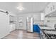 Well-lit kitchen featuring white cabinets, stainless steel appliances, and modern fixtures at 2829 Dakota Dr, Anderson, IN 46012