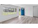 Open-concept living area with wood-look floors and a view of the front yard at 2829 Dakota Dr, Anderson, IN 46012