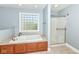 Bathroom featuring a soaking tub with tile surround, and a glass shower enclosure at 3050 Montgomery Blvd, Lapel, IN 46051