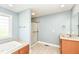 Bathroom featuring a soaking tub with tile surround, a shower, and a vanity at 3050 Montgomery Blvd, Lapel, IN 46051