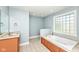 Bathroom featuring a soaking tub with tile surround, and a vanity at 3050 Montgomery Blvd, Lapel, IN 46051