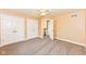 Spacious bedroom featuring neutral carpeting, large closets, and easy access to the stairs at 3050 Montgomery Blvd, Lapel, IN 46051
