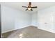 Carpeted bedroom with ceiling fan and a double door closet at 3050 Montgomery Blvd, Lapel, IN 46051
