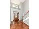 Grand foyer with hardwood floors, and staircase leading to the second level at 3050 Montgomery Blvd, Lapel, IN 46051