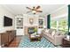 Cozy living room with a fireplace, built-in shelving, and large windows at 3050 Montgomery Blvd, Lapel, IN 46051
