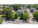 An aerial view showcases this beautiful home, surrounded by mature trees and manicured lawns in a desirable neighborhood at 3101 N Washington Blvd, Indianapolis, IN 46205