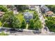 This aerial shot highlights a charming home with a spacious yard, mature trees, and a desirable neighborhood setting at 3101 N Washington Blvd, Indianapolis, IN 46205