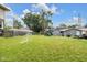 A sprawling backyard with a play set, soccer net, and detached garage, offering plenty of space for outdoor activities at 3101 N Washington Blvd, Indianapolis, IN 46205
