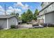 A well-manicured backyard with lush green grass, a patio, a detached garage, and room for outdoor activities at 3101 N Washington Blvd, Indianapolis, IN 46205