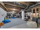Unfinished basement with exposed beams, concrete flooring and ample storage space at 3101 N Washington Blvd, Indianapolis, IN 46205