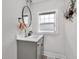 Bathroom features a gray vanity, modern fixtures, and stylish decor at 3101 N Washington Blvd, Indianapolis, IN 46205