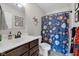 Bathroom featuring single sink vanity and baseball themed shower curtain at 3101 N Washington Blvd, Indianapolis, IN 46205
