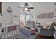 Cozy Bedroom with a crib, plush chair, and gray dresser at 3101 N Washington Blvd, Indianapolis, IN 46205