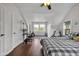 Bedroom features hardwood floors, vaulted ceilings, and lots of natural light at 3101 N Washington Blvd, Indianapolis, IN 46205