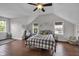 Bright bedroom features hardwood floors, vaulted ceilings, and lots of natural light at 3101 N Washington Blvd, Indianapolis, IN 46205