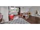 Bright bonus room with hardwood floors and lots of natural light, perfect for playroom or study at 3101 N Washington Blvd, Indianapolis, IN 46205