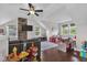 Bright bonus room features hardwood floors, vaulted ceilings, exposed brick wall, and lots of natural light at 3101 N Washington Blvd, Indianapolis, IN 46205