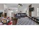 Bright bonus room features hardwood floors, vaulted ceilings, exposed brick wall, and lots of natural light at 3101 N Washington Blvd, Indianapolis, IN 46205
