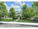 Attractive home with iron fence, green trees and lawn with sidewalk view at 3101 N Washington Blvd, Indianapolis, IN 46205