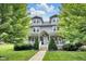 Charming gray two-story home with well-manicured lawn and inviting front porch at 3101 N Washington Blvd, Indianapolis, IN 46205