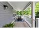 Inviting front porch featuring rocking chairs and stylish outdoor rug at 3101 N Washington Blvd, Indianapolis, IN 46205