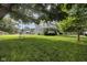 A large front yard with mature trees and lush green grass frames this beautiful home, enhancing its curb appeal at 3101 N Washington Blvd, Indianapolis, IN 46205
