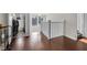Hallway features hardwood floors and white trim at 3101 N Washington Blvd, Indianapolis, IN 46205