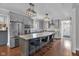 Modern kitchen features gray cabinets, stainless appliances, and a large island with seating at 3101 N Washington Blvd, Indianapolis, IN 46205