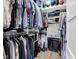 Walk-in closet with white shelving, hanging racks, and wood floors at 3101 N Washington Blvd, Indianapolis, IN 46205